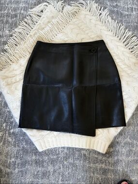 Babaton Black Faux Leather asymmetrical Mini Skirt .Button Detail and side zip
